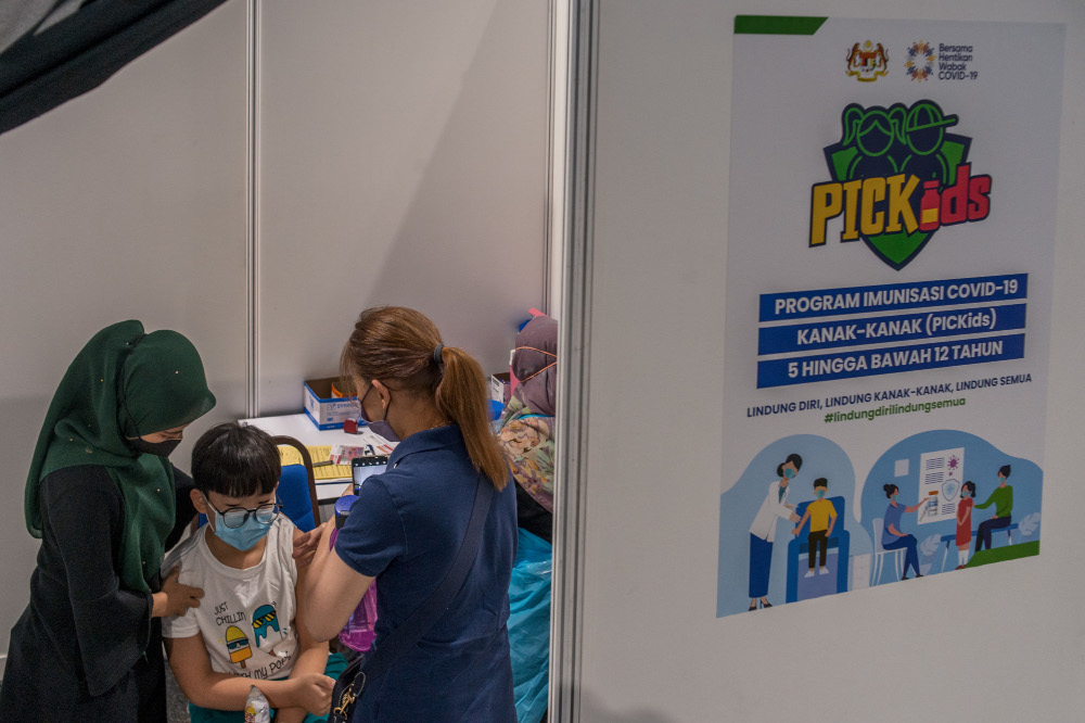 Children between the ages of five and 12 get their Covid-19 vaccine during the National Covid-19 Immunisation Programme for Kids (PICKids) at Axiata Arena in Bukit Jalil, February 3, 2022. u00e2u20acu201d Picture by Shafwan Zaidon