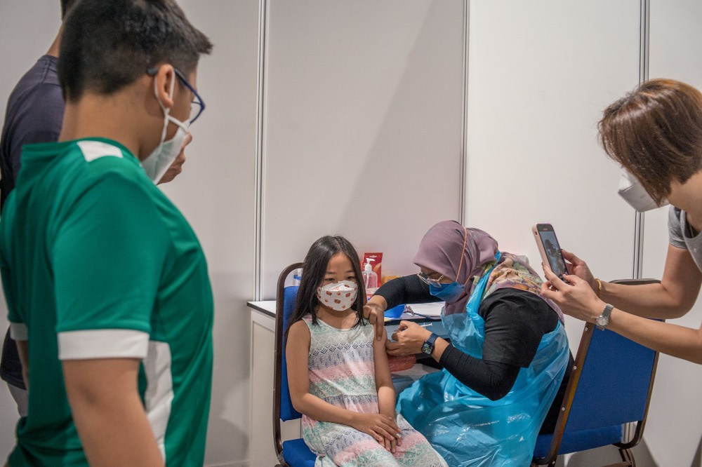 Children between the ages of five and 12 get their Covid-19 vaccine during the National Covid-19 Immunisation Programme for Kids (PICKids) at Axiata Arena in Bukit Jalil, February 3, 2022. u00e2u20acu201d Picture by Shafwan Zaidon