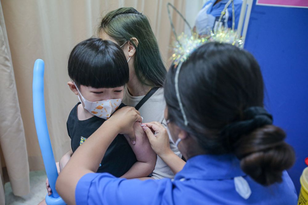 A child gets his Covid-19 jab during the National Covid-19 Immunisation Programme for Kids at the Perak Community Specialist Hospital in Ipoh February 25, 2022. u00e2u20acu201d Picture by Farhan Najib