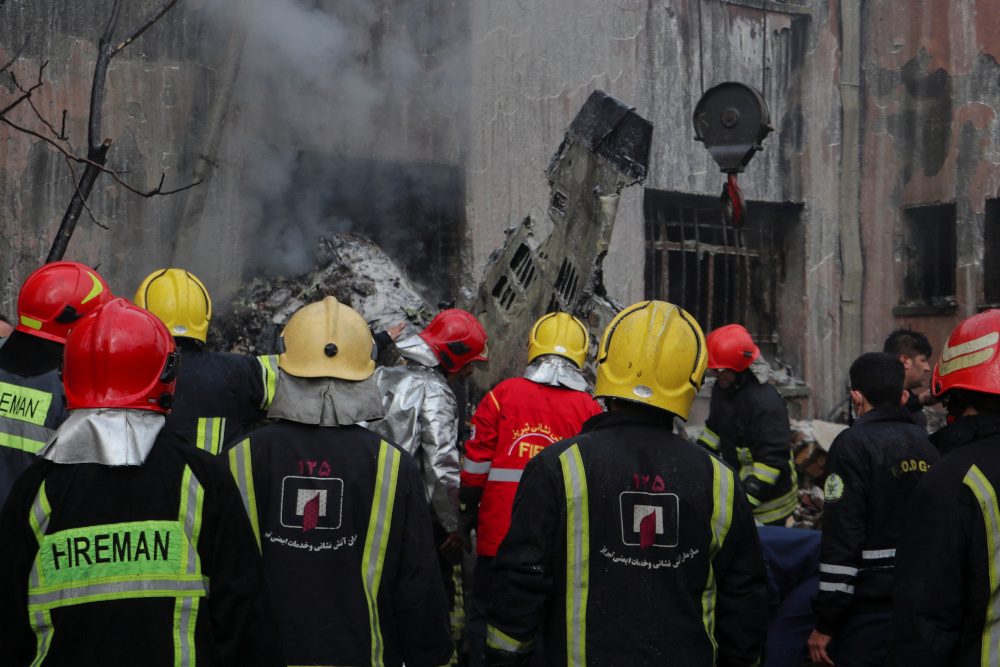 First responder units work after a fighter jet crashed in Tabriz, Iran, February 21, 2022. u00e2u20acu201d Mehr News/Wana (West Asia News Agency) via Reuters 