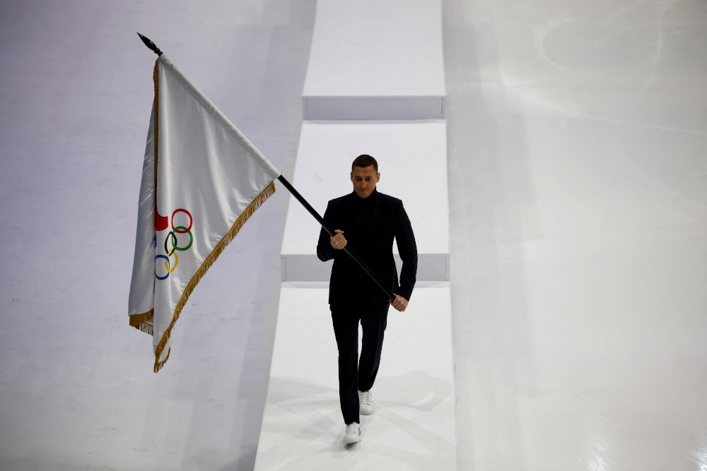 Retired Russian cross-country skier Alexander Legkov carries the flag of the Russian Olympic Committee during the presentation of uniforms for Russian athletes competing in the 2022 Winter Olympics in Beijing, in Moscow December 10, 2021. u00e2u20acu201d Reuters pic