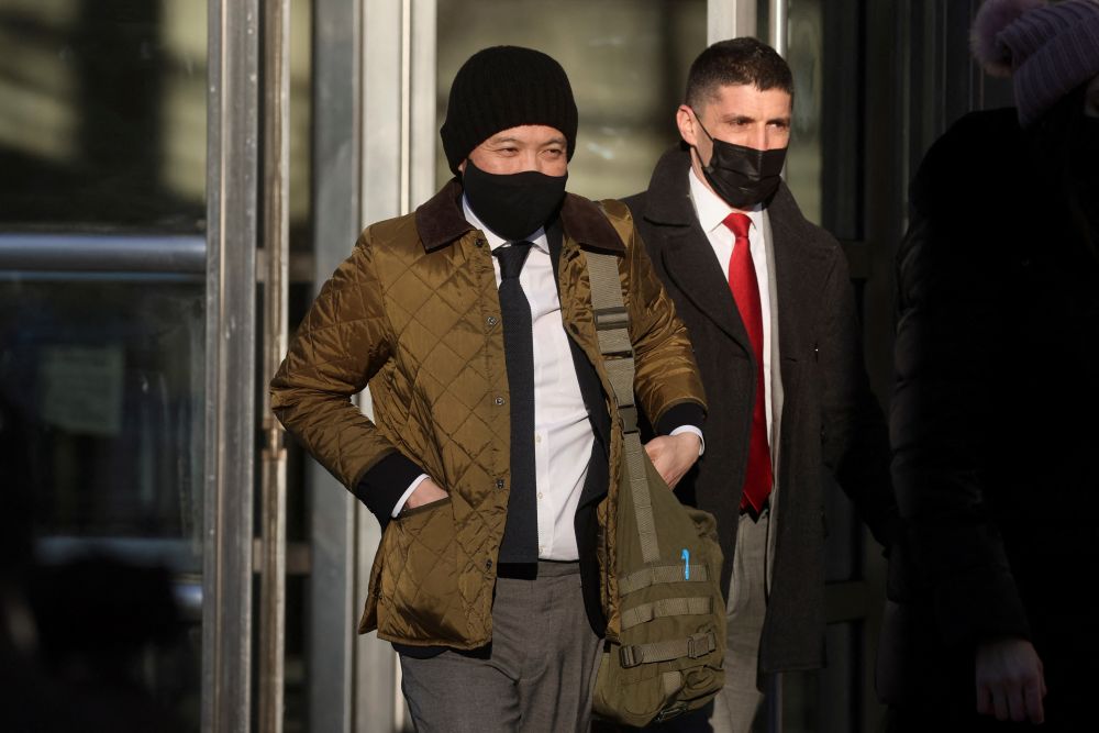 Ex-Goldman Sachs banker Roger Ng exits after the first day of his criminal trial, at the United States Courthouse in Brooklyn, New York, U.S., February 14, 2022. 