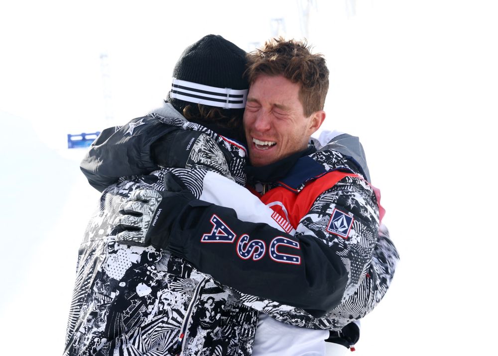 Shaun White of the United States hugs his teammate after the menu00e2u20acu2122s snowboard halfpipe final at the Genting Snow Park in Zhangjiakou February 11, 2022. u00e2u20acu201d Reuters picnn
