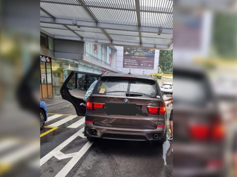 A view of a BMW parked outside United Square mall in the Novena area. Its driver is alleged to have injured a security guard there. u00e2u20acu2022 Picture courtesy of Union of Security Employees