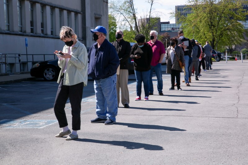 People line up outside a newly reopened career center for in-person appointments in Louisville, US, April 15, 2021. u00e2u20acu201d Reuters pic