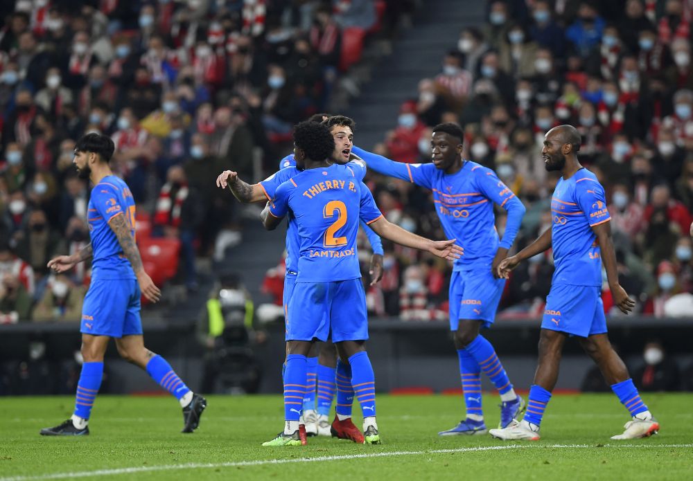 Valencia's players celebrate their first goal during the Spanish Copa del Rey semi-final against Athletic Club Bilbao at the San Mames stadium in Bilbao February 10, 2022. u00e2u20acu201d AFP pic