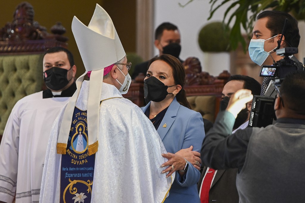 Honduran president-elect Xiomara Castro is greeted by a priest during a mass on the 275th apparition of the Suyapa Virgin, Hondurasu00c2u00b4 patron saint, at the Suyapa Basilica in Tegucigalpa on February 3, 2022. u00e2u20acu201d AFP pic