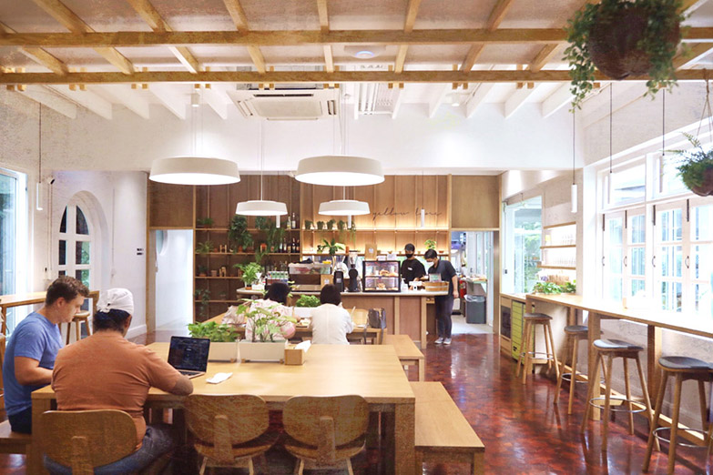The warm and serene interior of Yellow Lane, a brunch café in Ari, Bangkok.