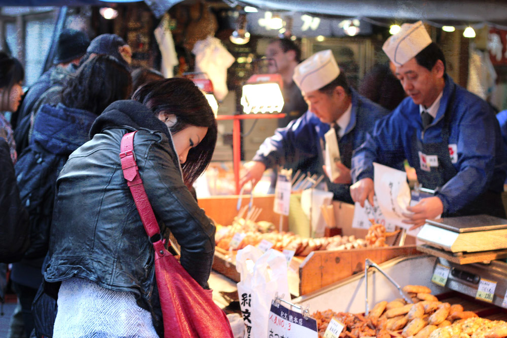 Customers at a fried foods shop.