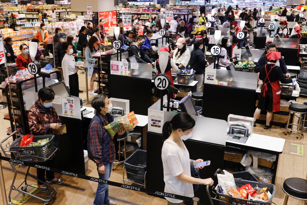 Customers wearing face masks queue up to pay at a supermarket, ahead of mass Covid-19 testing, inu00c2u00a0Hongu00c2u00a0Kong, China March 2, 2022. u00e2u20acu2022 Reuters picn