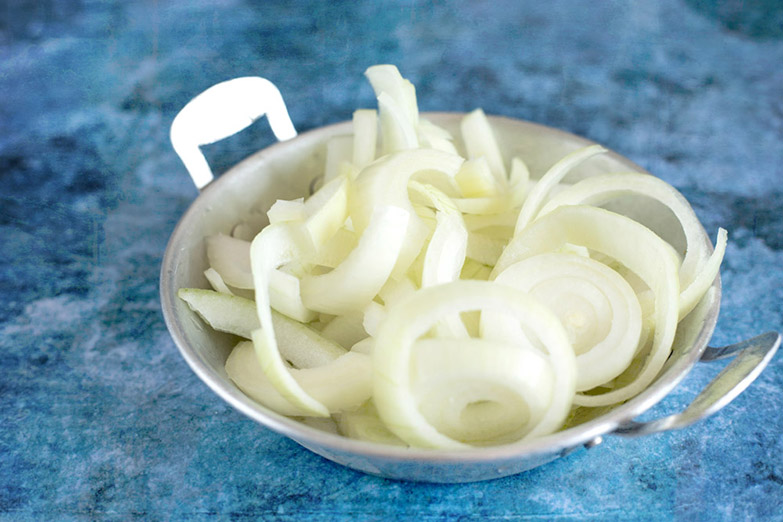 Sliced onions, ready to be added to the pot or caramelised first.