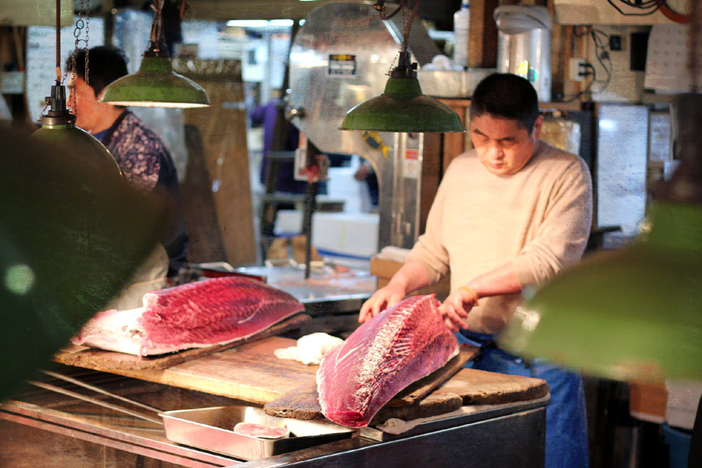 Slicing tuna at the market.