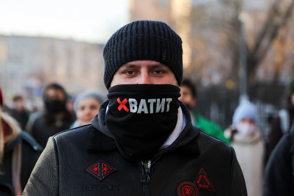 A person wearing a mask with the slogan u00e2u20acu02dcenoughu00e2u20acu2122 attends a protest against Russian invasion of Ukraine, after President Vladimir Putin authorised a massive military operation, in Moscow, Russia February 27, 2022. u00e2u20acu201d Reuters pic