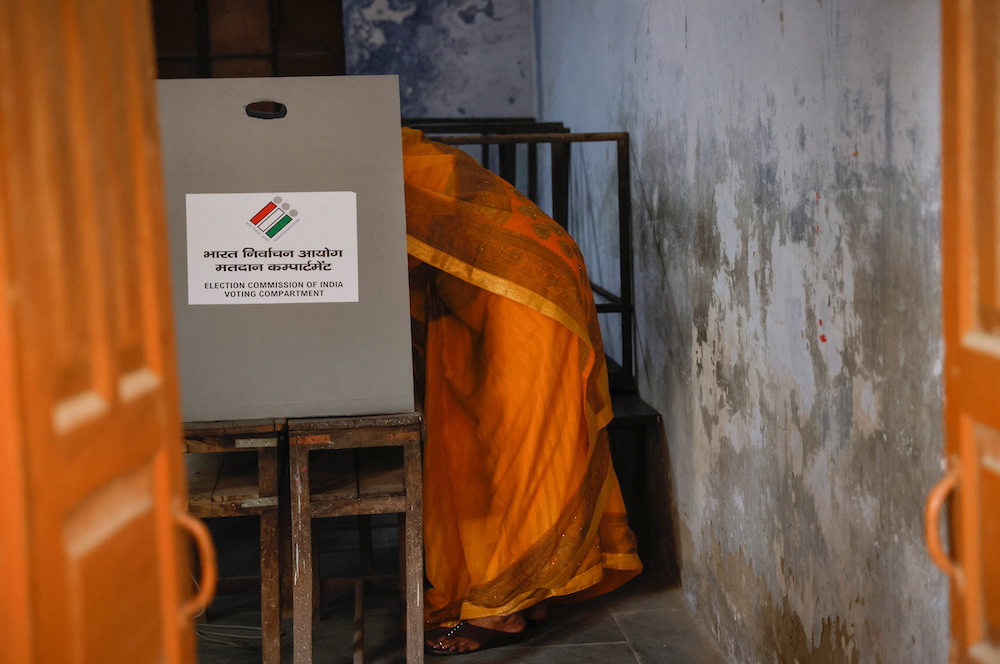 A woman casts her vote at a polling station during the last phase of state assembly election in Varanasi in the northern state of Uttar Pradesh, India March 7, 2022. u00e2u20acu201d Reuters pic 