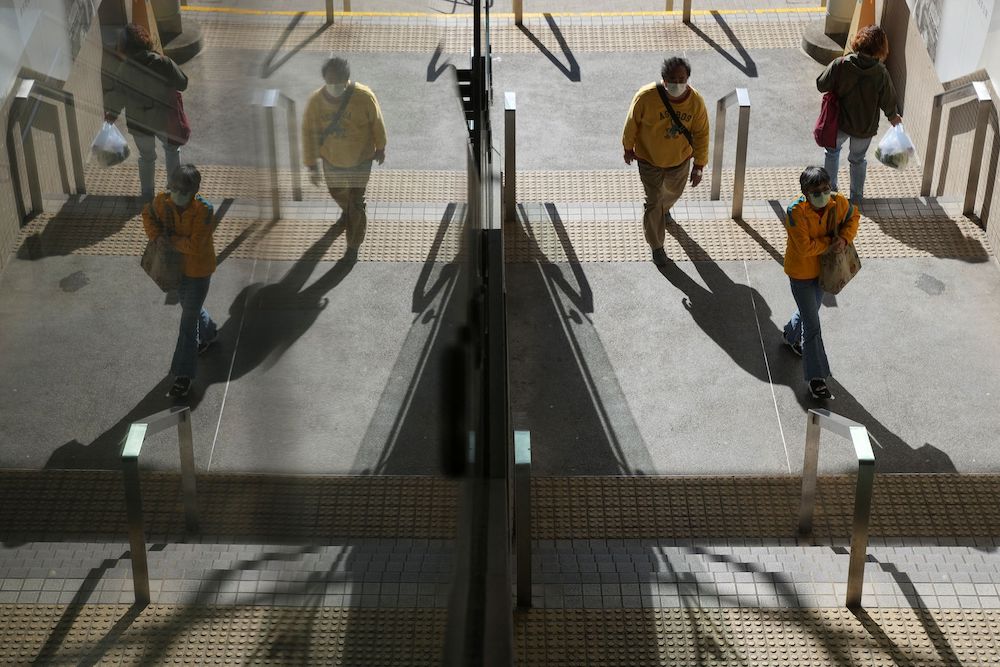 Pedestrians wearing face masks walk on a street, following the Covid-19 outbreak, in Hong Kong, China March 9, 2022. u00e2u20acu201d Reuters pic
