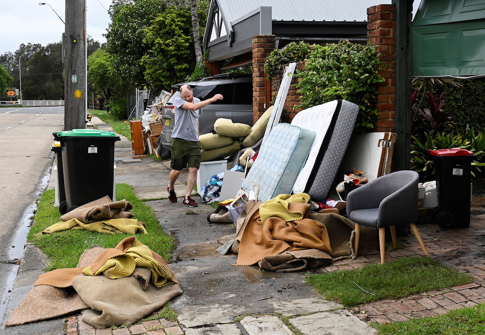A man moves belongings out of a flooded-affected house in the suburb of North Manly, Sydney, Australia March 9, 2022. u00e2u20acu201d Reuters pic