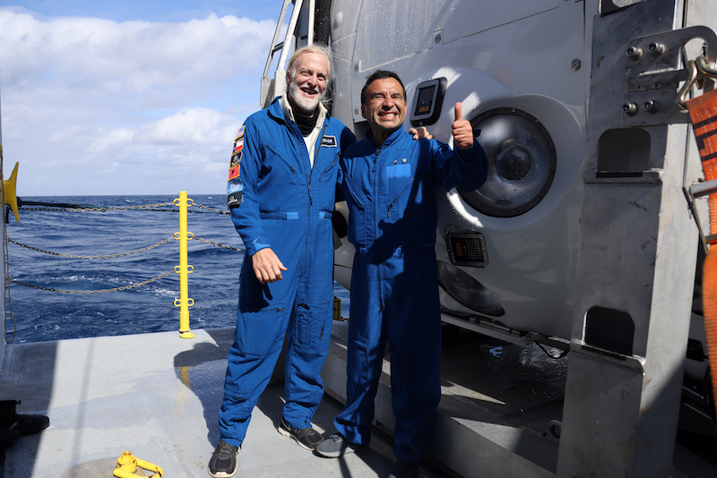 Chilean scientist Oswaldo Ulloa (right) and US explorer Victor Vescovo celebrating after descending 8,000 meters in the Pacific Ocean, off the coasts of Antofagasta, Chile January 20, 2022. u00e2u20acu201d Caladan Oceanic-IMO pic via AFP