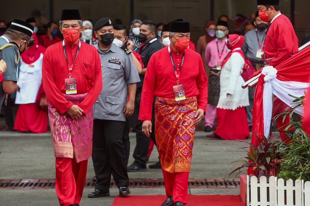 Umno President Zahid Hamidi and Umno Deputy President Mohamad Hassan arrive for the party's 2022 general assembly in Kuala Lumpur March 18, 2022. ― Picture by Hari Anggara