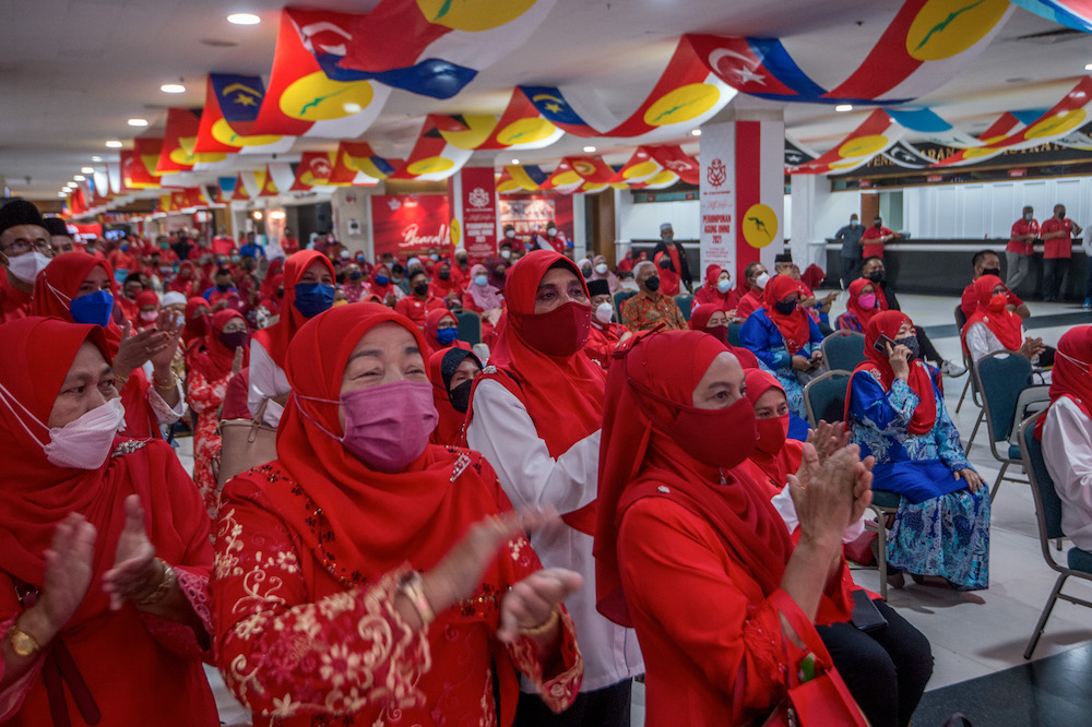Umno members at the party's 2022 general assembly in Kuala Lumpur March 16, 2022. ― Picture by Shafwan Zaidon