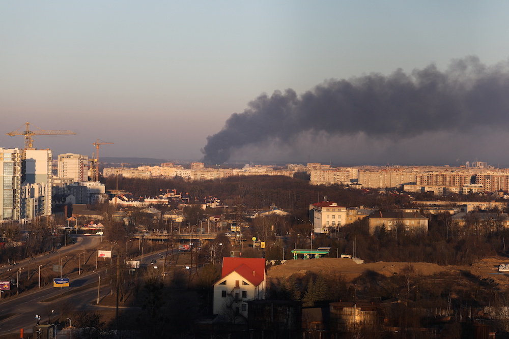 Smoke rises above buildings near Lviv airport, as Russia's invasion of Ukraine continues, in Lviv, Ukraine March 18, 2022. u00e2u20acu201d Reuters pic