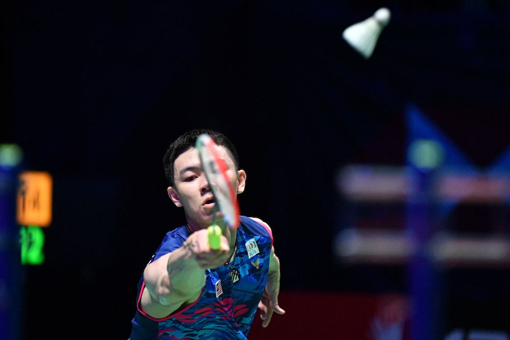 Malaysia's Lee Zii Jia returns to India's Lakshya Sen during their men's single's semi-final at the All England Open Badminton Championship at the Utilita Arena in Birmingham March 19, 2022. u00e2u20acu201d AFP pic