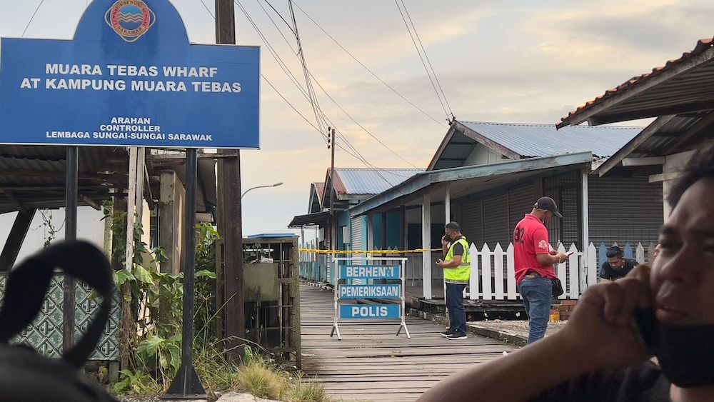 Police cordoning off the jetty where the body of Eric was allegedly dumped on March 13. — Picture by Roy Emmor via Borneo Post