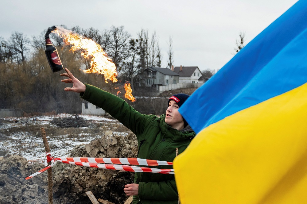 A civilian trains to throw Molotov cocktails to defend the city, as Russiau00e2u20acu2122s invasion of Ukraine continues, in Zhytomyr, Ukraine March 1, 2022. u00e2u20acu201d Reuters pic