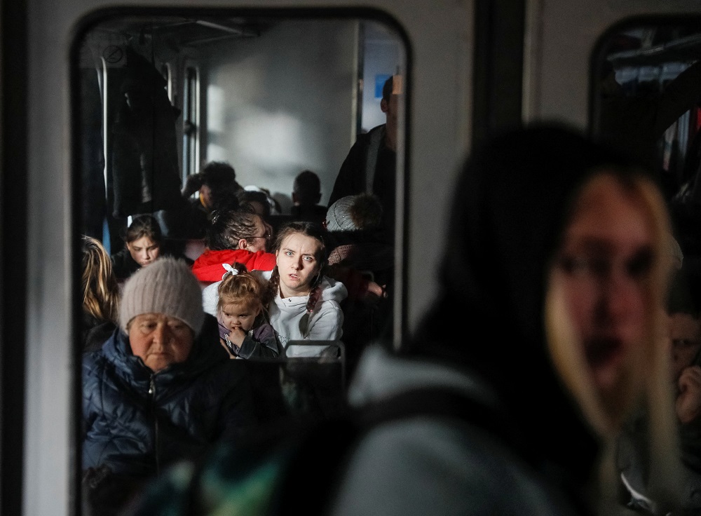People are seen standing and sitting in an evacuation train from Kyiv to Lviv, at Kyiv central train station, amid Russia's invasion of Ukraine, in Kyiv, Ukraine March 11, 2022. u00e2u20acu201d Reuters pic