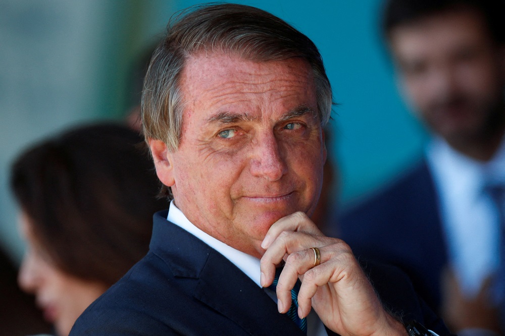 Brazil's President Jair Bolsonaro looks on during a welcome ceremony to receive the Brazilians and foreigners evacuated from Ukraine during the mission of repatriation, at the Brasilia Air Base, in Brasilia March 10, 2022. u00e2u20acu201d Reuters pic