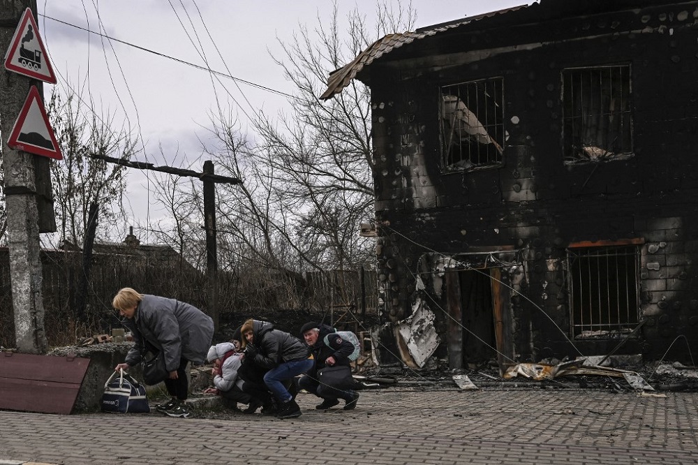 People take cover from shelling in the city of Bucha, west of Kyiv, March 4, 2022. u00e2u20acu201d AFP pic