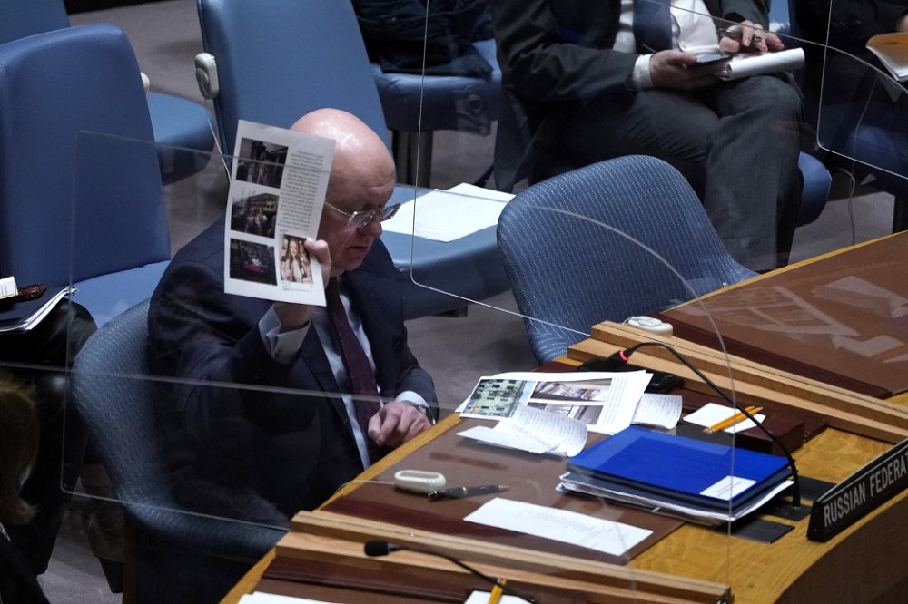 Russia Ambassador to the UN Vassily Nebenzia shows documents during a UN Security Council emergency meeting, in New York on March 11, 2022. u00e2u20acu201d AFP pic