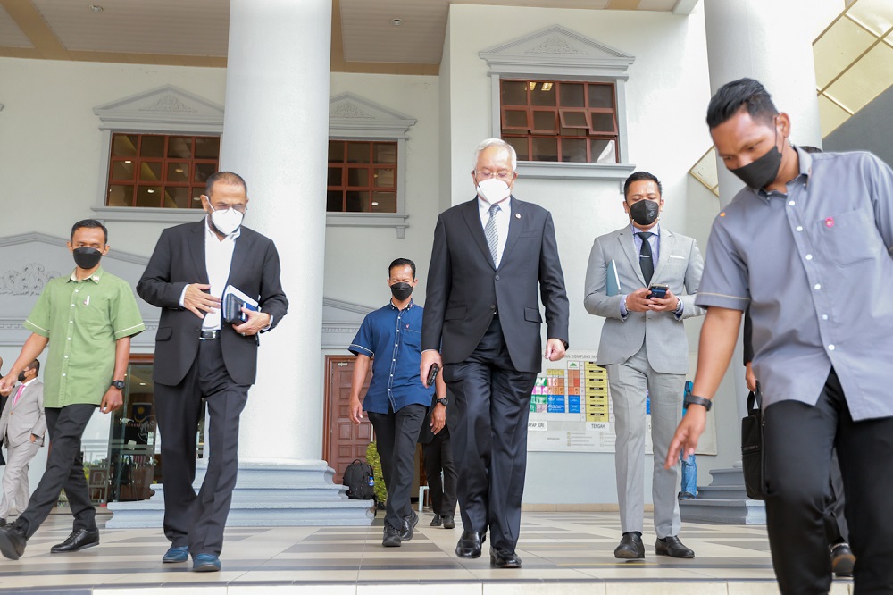 Datuk Seri Najib Razak (centre) leaves the Kuala Lumpur court complex March 14 2022. u00e2u20acu201d Picture by Devan Manuel 
