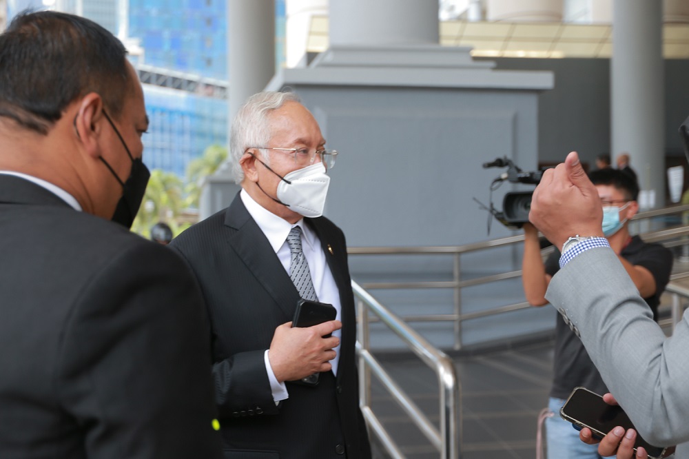 Datuk Seri Najib Razak (centre) leaves the Kuala Lumpur court complex March 14 2022. u00e2u20acu201d Picture by Devan Manuel 