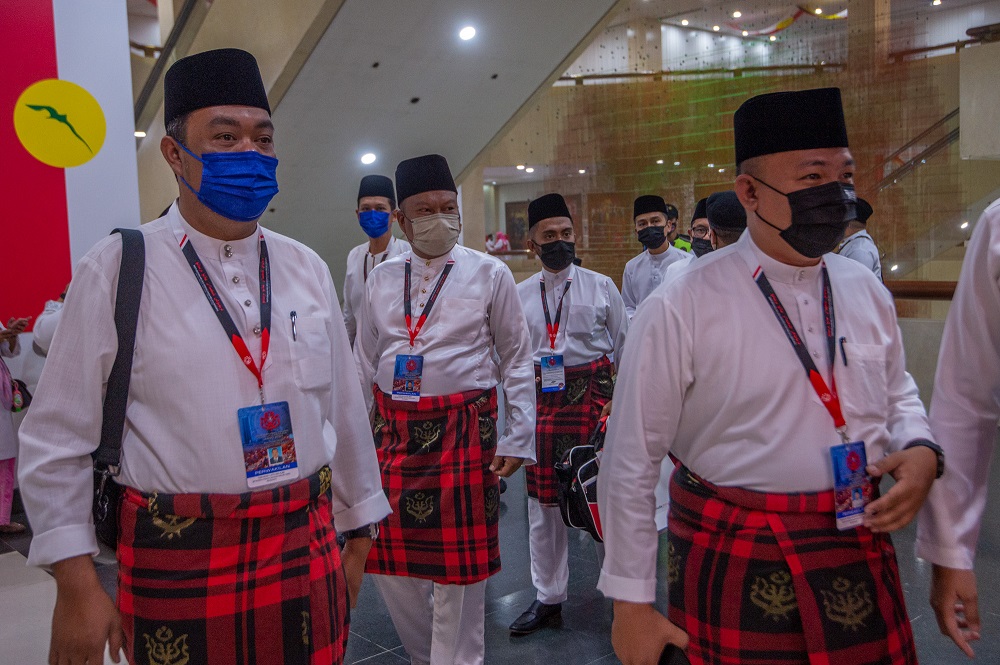 Umno Youth members arrive for the general assembly of Umnou00e2u20acu2122s Women, Youth and Puteri Wing in Kuala Lumpur March 16, 2022. u00e2u20acu201d Picture by Shafwan Zaidon