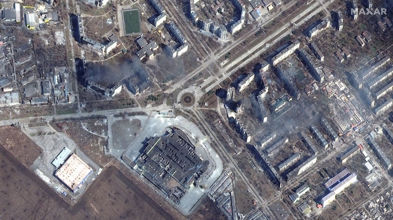 A satellite image shows burning and destroyed apartment buildings and the Port City Shopping Mall in western Mariupol, Ukraine, March 14, 2022. u00e2u20acu201d Maxar Technologies handout via Reuters pic