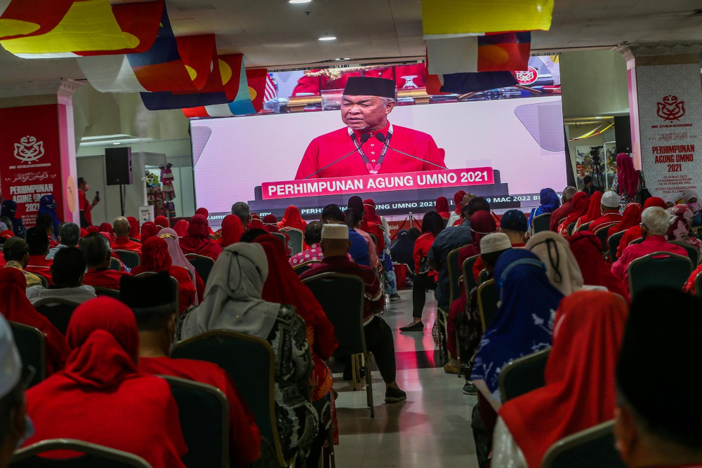 Umno president Datuk Seri Ahmad Zahid Hamidi delivers his opening speech during the 2021 Umno General Assembly at the World Trade Centre in Kuala Lumpur March 18, 2022. u00e2u20acu2022 Picture by Hari Anggara 