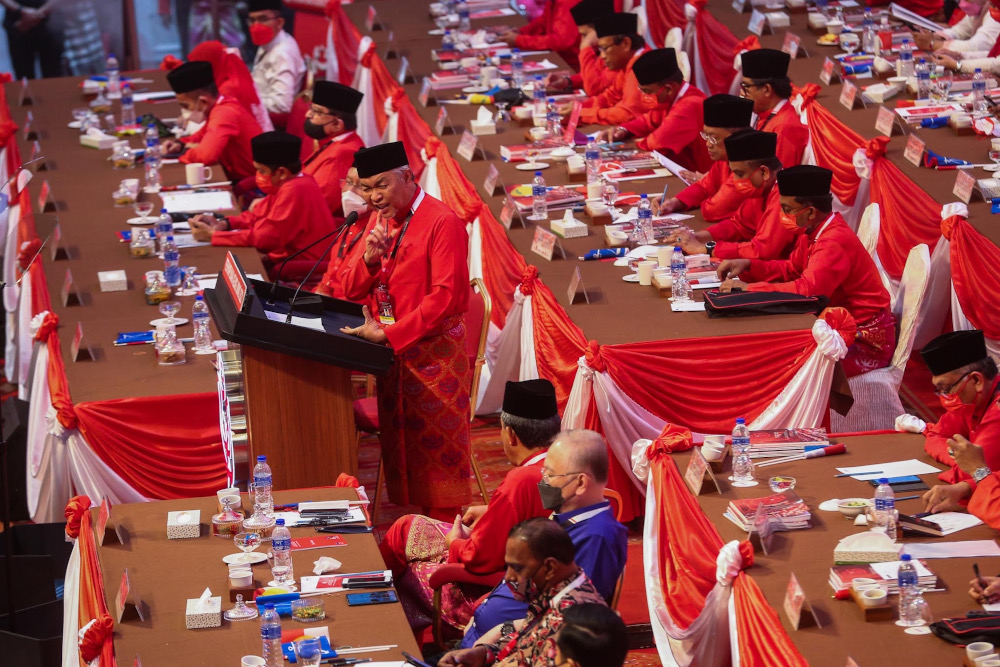 Umno president Datuk Seri Ahmad Zahid Hamidi delivers his opening speech during the 2021 Umno General Assembly at the World Trade Centre in Kuala Lumpur March 18, 2022. u00e2u20acu2022 Picture by Hari Anggara 