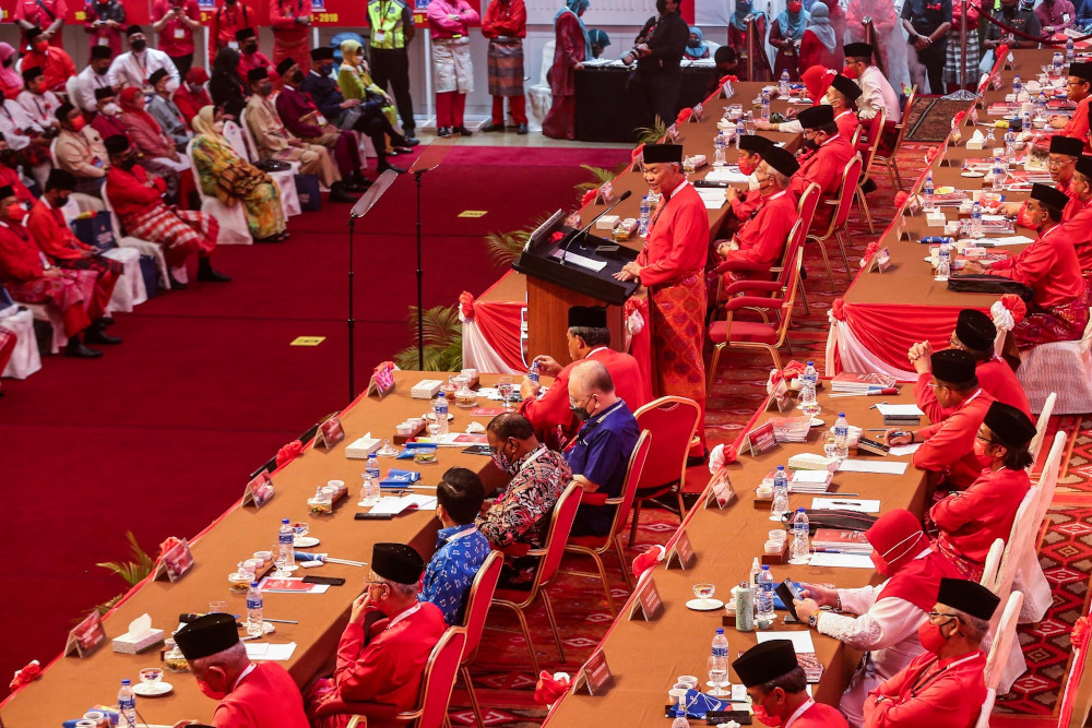 Umno president Datuk Seri Ahmad Zahid Hamidi delivers his opening speech during the 2021 Umno General Assembly at the World Trade Centre in Kuala Lumpur March 18, 2022. u00e2u20acu2022 Picture by Hari Anggara 