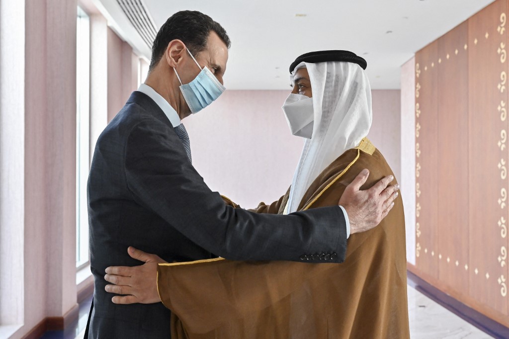 A handout picture shows Syriau00e2u20acu2122s President Bashar al-Assad (left) being greeted by Sheikh Mansour bin Zayed Al Nahyan, in the capital Abu Dhabi March 18, 2022. u00e2u20acu201d Handout by Hassan Al Menhali / UAEu00e2u20acu2122s Ministry of Presidential Affairs via AFP