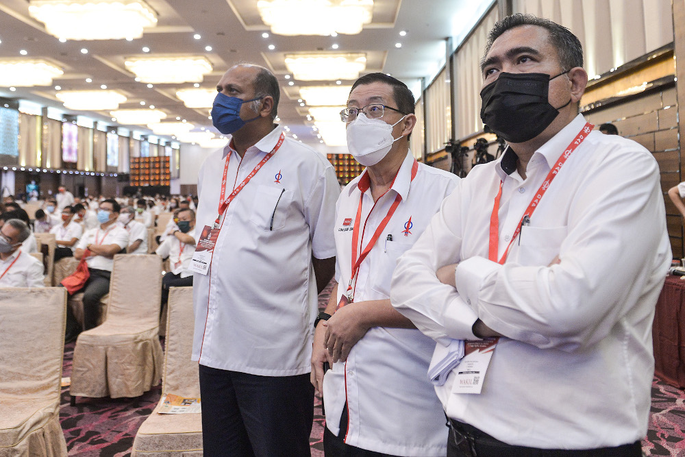 Candidates for the DAP supreme council, (from left) Anthony Loke, Lim Guan Eng and Gobind Singh Deo waiting for the result announcement during DAPu00e2u20acu2122s 17th Party Congress in IDCC on March 20, 2022. u00e2u20acu201d Picture by Miera Zulyana