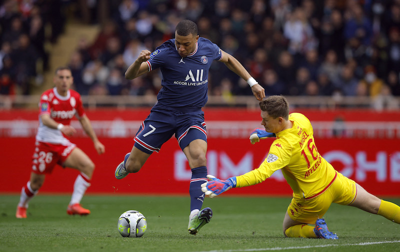 Paris St Germain's Kylian Mbappe in action with AS Monaco's Alexander Nubel Stade Louis II, Monaco - March 20, 2022. u00e2u20acu201d Reuters pic