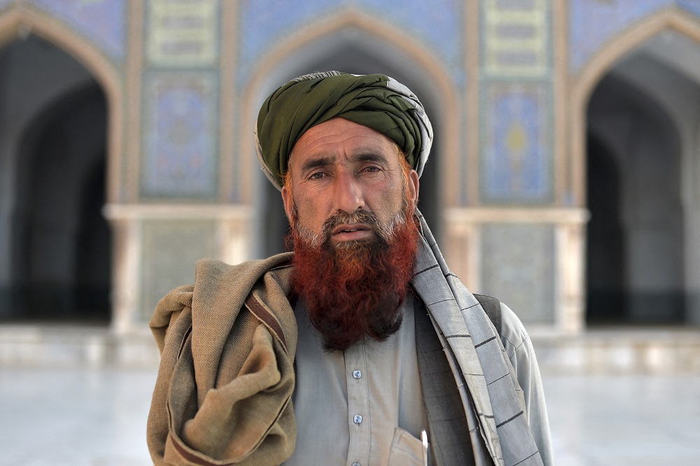An Afghan man wearing a turban poses for a photograph in the courtyard of Jami Mosque in Herat. u00e2u20acu201d AFP pic