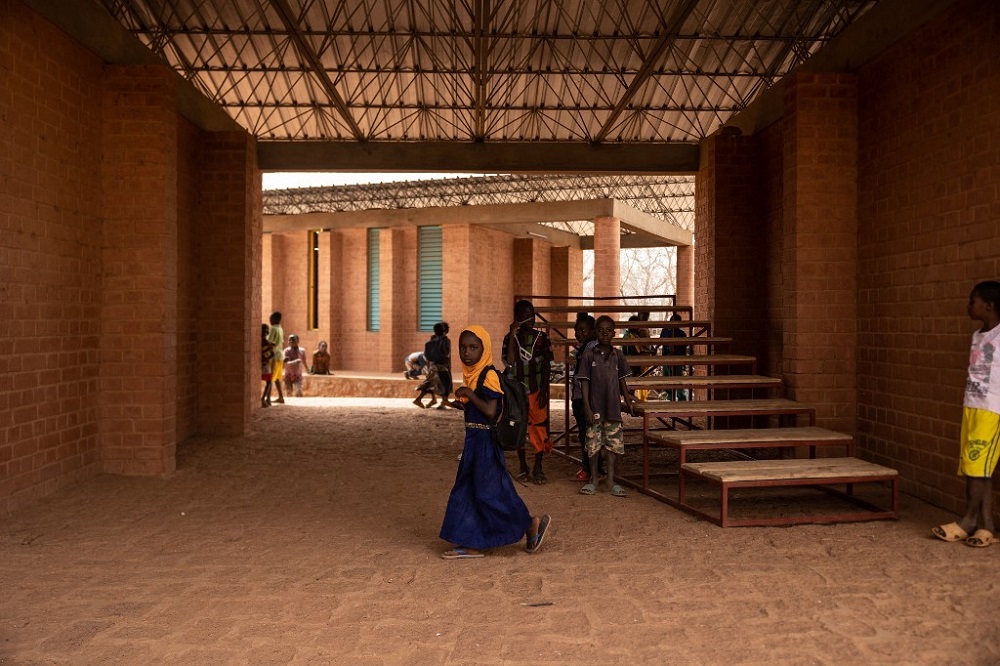 A girl walks at the Village-Opera school, designed by Architect Diebedo Francis Kere, in Laongo March 16, 2022. u00e2u20acu201d AFP pic