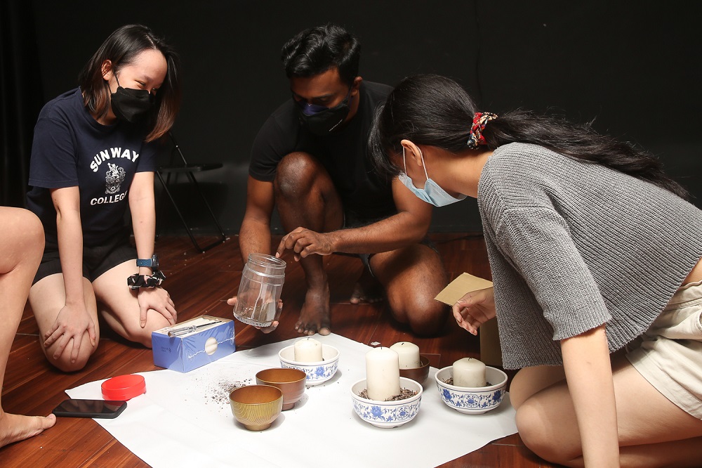 Theatresauce EDL director Dinesh Kumar (centre) assisted by Theatresauce staff prepares for his segment in u00e2u20acu02dcChildren Should Not Play in the Darku00e2u20acu2122.  u00e2u20acu201d  Picture by Choo Choy May