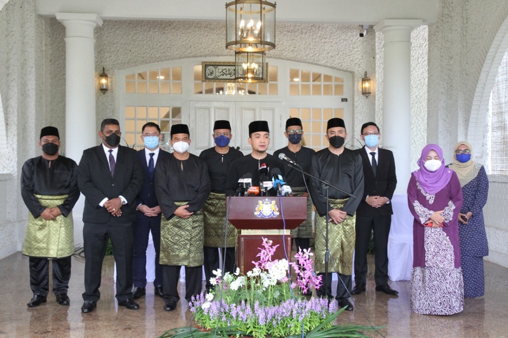 Johor Mentri Besar Datuk Onn Hafiz Ghazi (centre) announcing the portfolio line-up for the state executive council members at the Saujana in Johor Baru March 26, 2022. u00e2u20acu201d Picture by Ben Tan