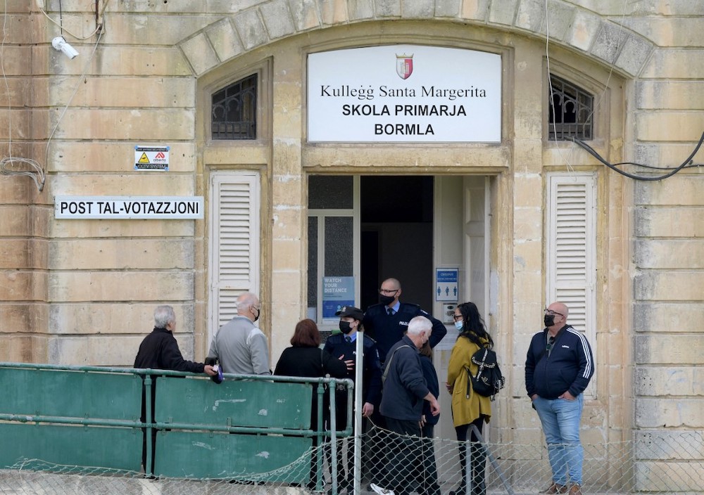 People queue outside a polling station in Cospicua on March 26, 2022 during the Malta's general election. u00e2u20acu201d AFP picnn