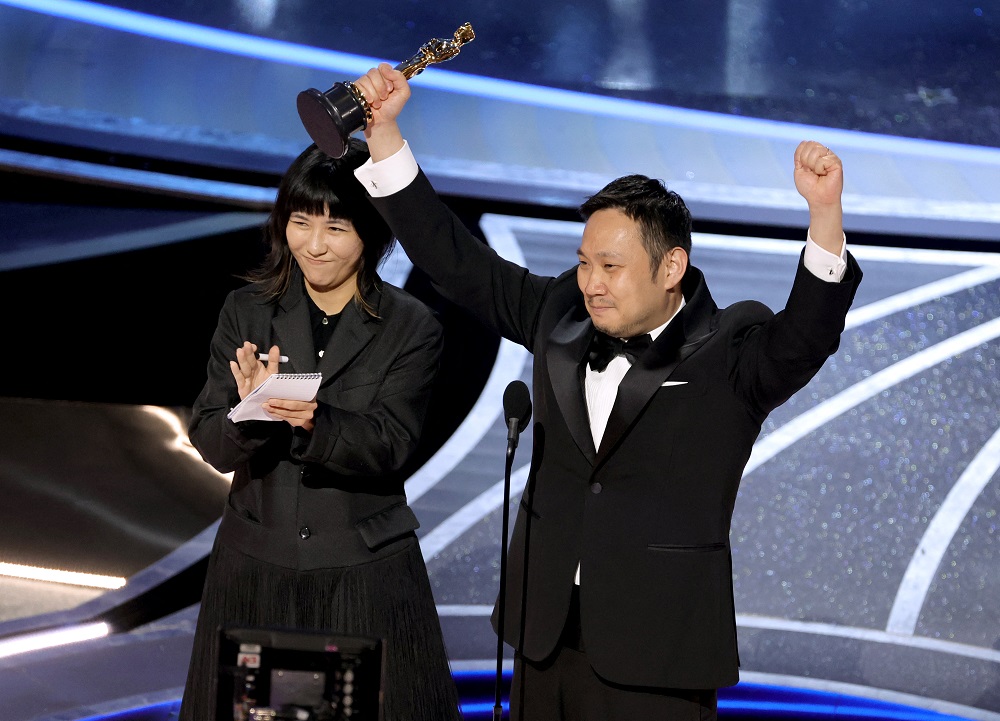 Ryusuke Hamaguchi (right) accepts the International Feature Film award for u00e2u20acu02dcDrive My Caru00e2u20acu2122 onstage during the 94th Annual Academy Awards at Dolby Theatre on March 27, 2022 u00e2u20acu201d Picture by Neilson BarnardGetty Images via AFP