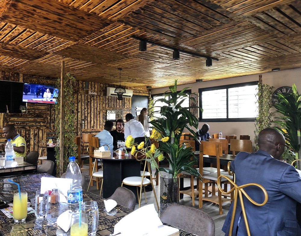 At the Chez Ju00c3u00b6el maquis in the commune of Cocody. u00e2u20acu201d Photography Louis Bolla via ETX Studio