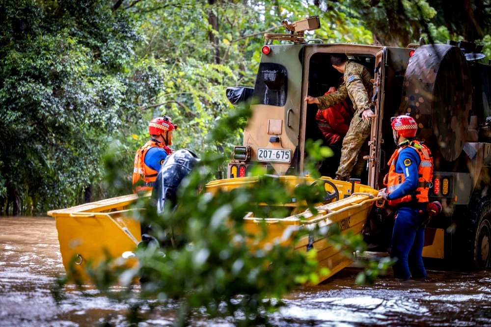 Australian Army soldiers work with the State Emergency Services volunteers in a Bushmaster protected mobility vehicle in New South Wales town of Lismore March 30, 2022. u00e2u20acu201d Picture by Australian Defence Force via AFP