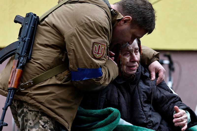 A Ukrainian serviceman hugs his mother Larysa Kolesnyk, 82, after she was evacuated from Irpin town, as Russia's attack on Ukraine continues, on the outskirts of Kyiv, Ukraine March 30, 2022. u00e2u20acu201d Reuters picnn